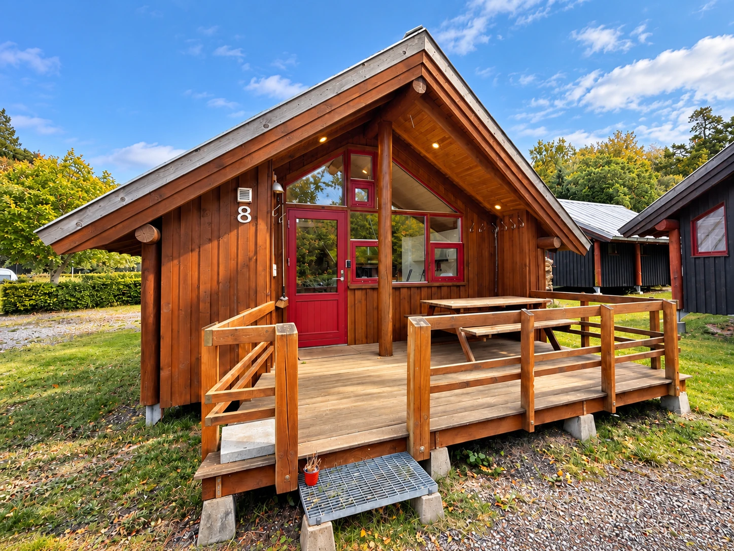 Komforthytte – exterior Komforthytte with large wooden terrace